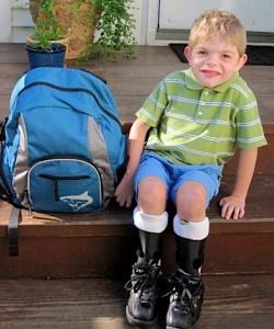 Ben sitting with a backpack