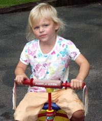 Sophia on a radio flyer