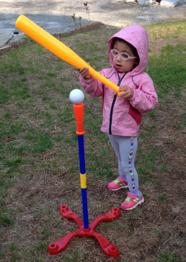 Nina playing T-ball