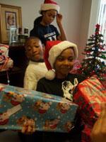 children opening Christmas presents